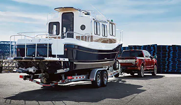 2022 Nissan TITAN Truck towing boat | All Star Nissan in Denham Springs LA